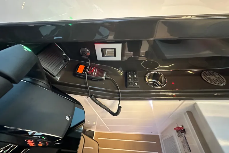 Slide: The Image of Control panel of 2027 Tiara Yachts 39 LE featuring modern navigation and communication equipment. - 27