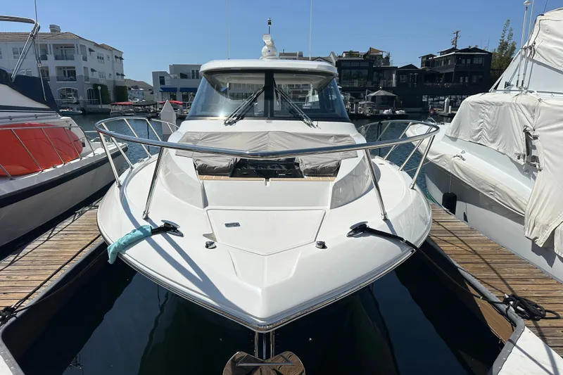 Slide: The Image of 2027 Tiara Yachts 39 LE docked, showcasing sleek design and modern features. - 16