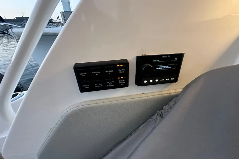 Slide: The Image of Control panel and audio system on 2027 Tiara Yachts 39 LE, dockside view. - 24