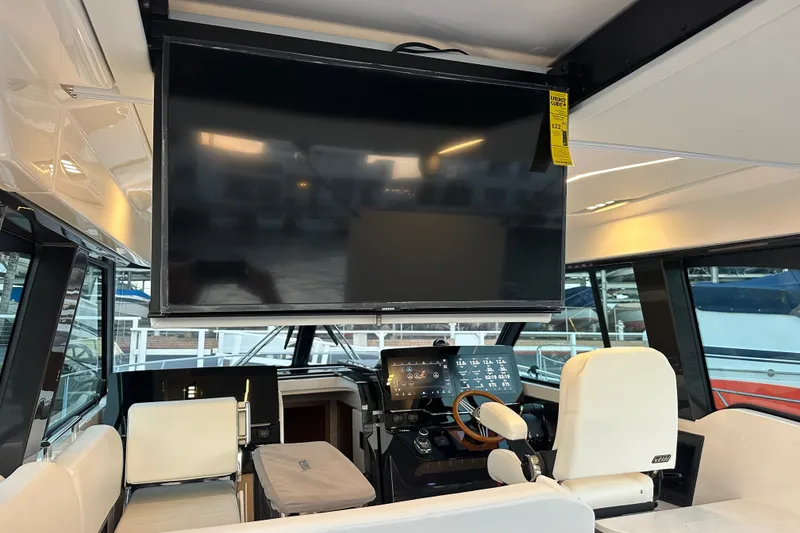 Slide: The Image of Interior of 2027 Tiara Yachts 39 LE with helm and large screen display. - 14