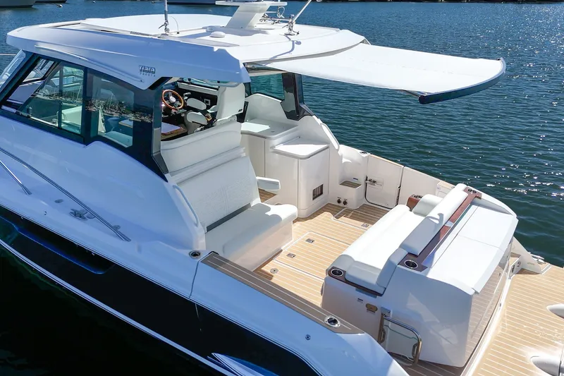 Slide: The Image of Luxurious 2027 Tiara Yachts 39 LE with spacious deck and modern amenities on the water. - 13