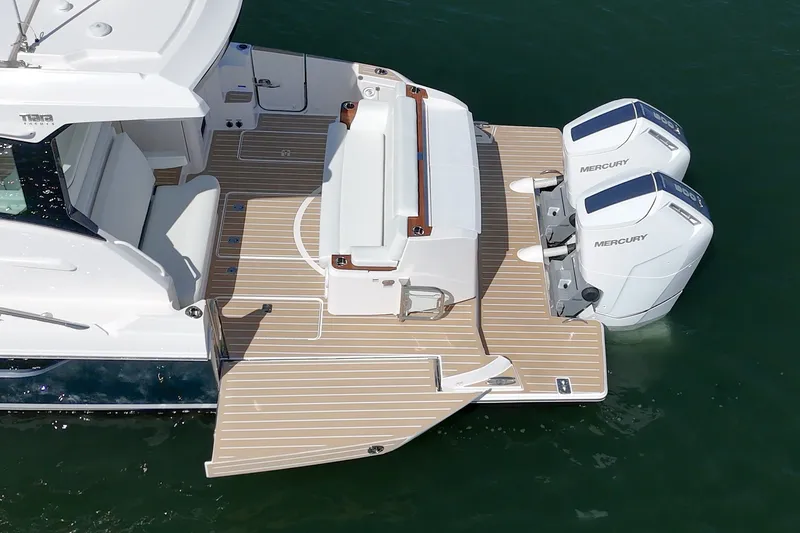 Slide: The Image of 2027 Tiara Yachts 39 LE with dual Mercury engines on teak deck. - 23