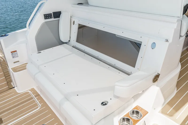 Slide: The Image of 2027 Tiara Yachts 39 LE interior seating with storage compartment, featuring sleek design. - 41