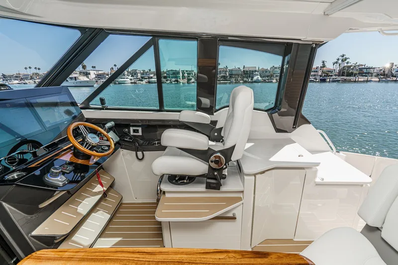 Slide: The Image of Interior of 2027 Tiara Yachts 39 LE, featuring modern helm and luxurious seating. - 50