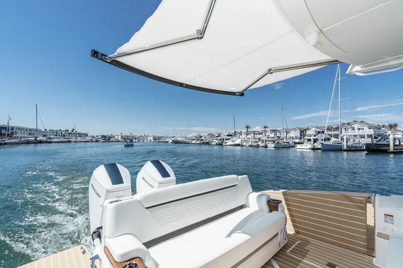 Slide: The Image of Tiara Yachts 2027 39 LE cruising in a sunny marina, showcasing luxury and performance. - 33