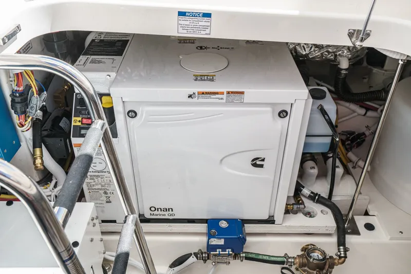 Slide: The Image of Engine compartment of 2027 Tiara Yachts 39 LE featuring Onan Marine generator. - 83