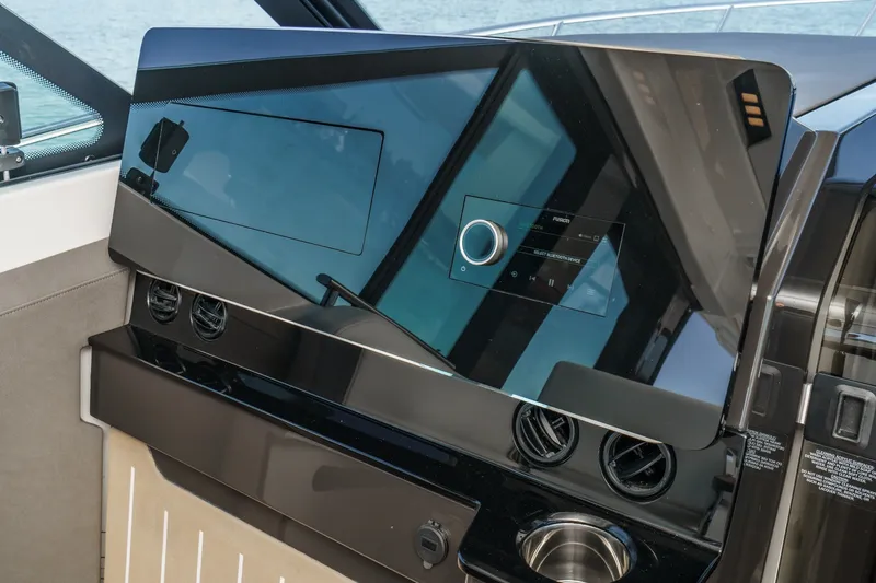 Slide: The Image of Dashboard of 2027 Tiara Yachts 39 LE with modern controls and sleek design. - 48