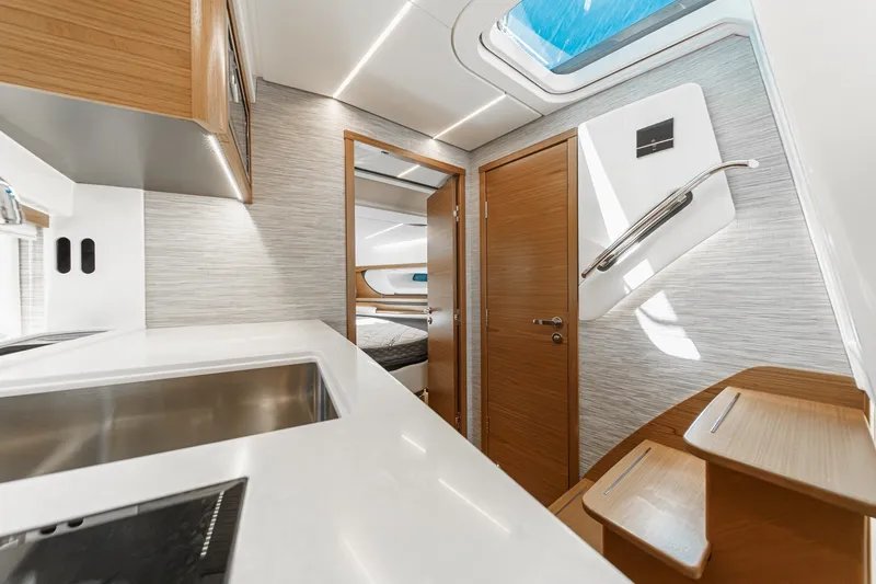 Slide: The Image of Modern interior of 2027 Tiara Yachts 39 LE, featuring sleek design and wooden accents. - 63