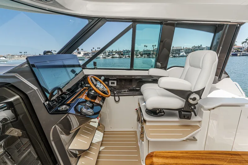 Slide: The Image of Helm of 2027 Tiara Yachts 39 LE, featuring modern controls and luxurious seating. - 54