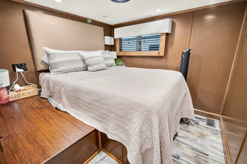 Slide: The Image of Cozy bedroom interior in 2016 Thoroughbred 21 x 100, featuring a neatly made bed and wooden accents. - 20