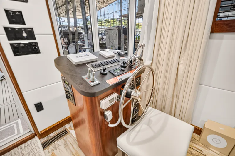 Slide: The Image of Helm station of 2016 Thoroughbred 21 x 100 yacht with steering wheel and controls. - 9
