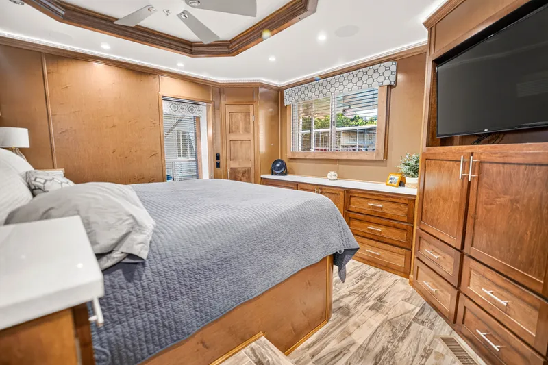 Slide: The Image of Luxurious bedroom in 2016 Thoroughbred model, featuring wooden cabinetry and modern decor. - 18