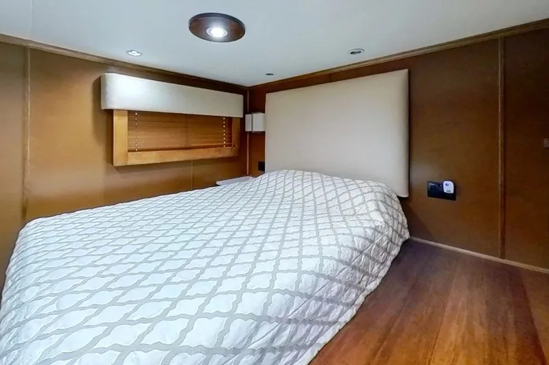 Slide: The Image of Modern bedroom interior in 2016 Thoroughbred 21 x 100, featuring wooden accents and cozy bedding. - 15