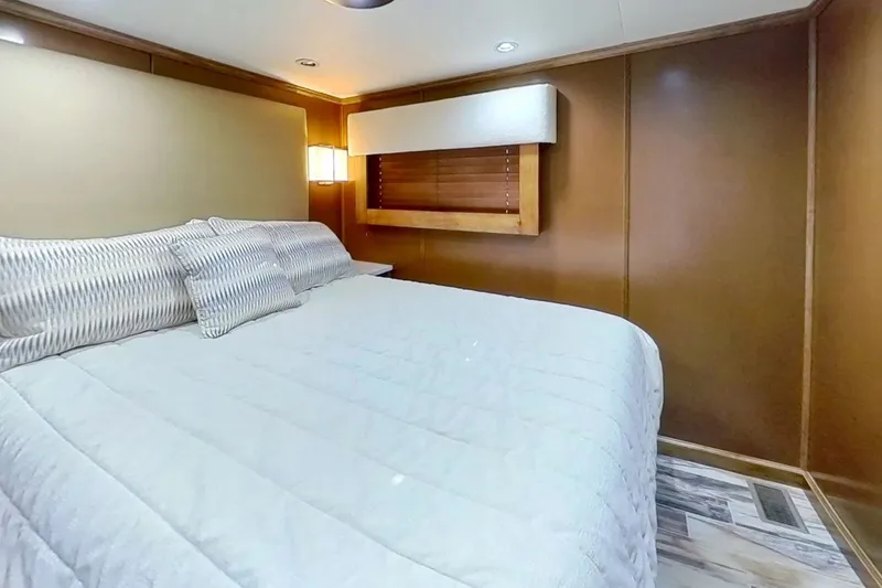 Slide: The Image of Luxurious bedroom interior in 2016 Thoroughbred 21 x 100 model, featuring cozy bedding and elegant wood paneling. - 14