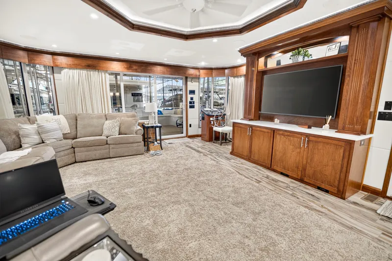 Slide: The Image of Luxurious living area in a 2016 Thoroughbred 21 x 100 houseboat with modern amenities. - 8