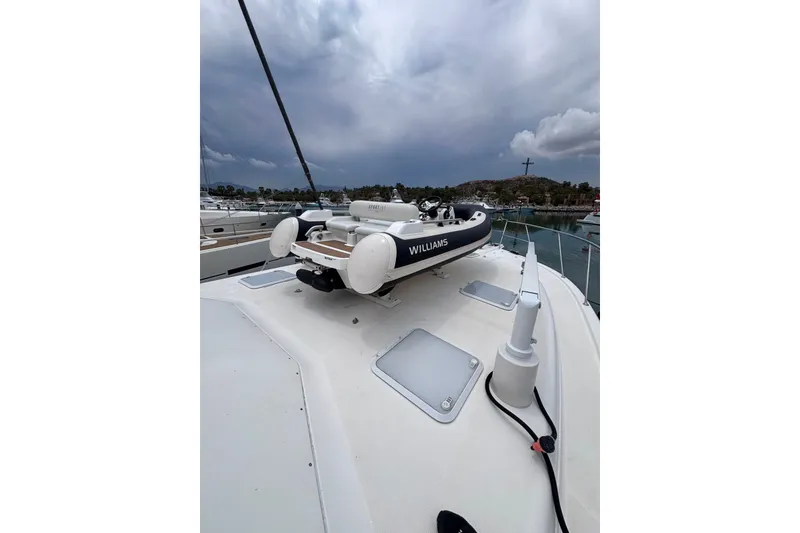 Slide: The Image of 2022 Williams Jet Tenders 345 Sports Jet on yacht deck under cloudy sky. - 3