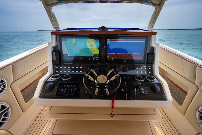 Slide: The Image of 2024 Concept 44' Open Deck yacht helm with advanced navigation screens and controls. - 18