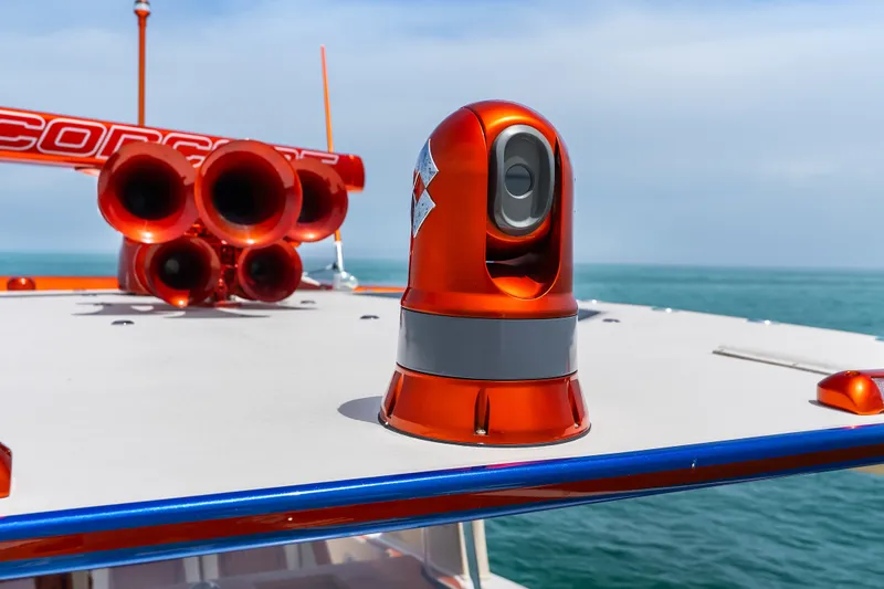 Slide: The Image of Orange and gray equipment on 2024 Concept 44' Open Deck boat against ocean backdrop. - 41