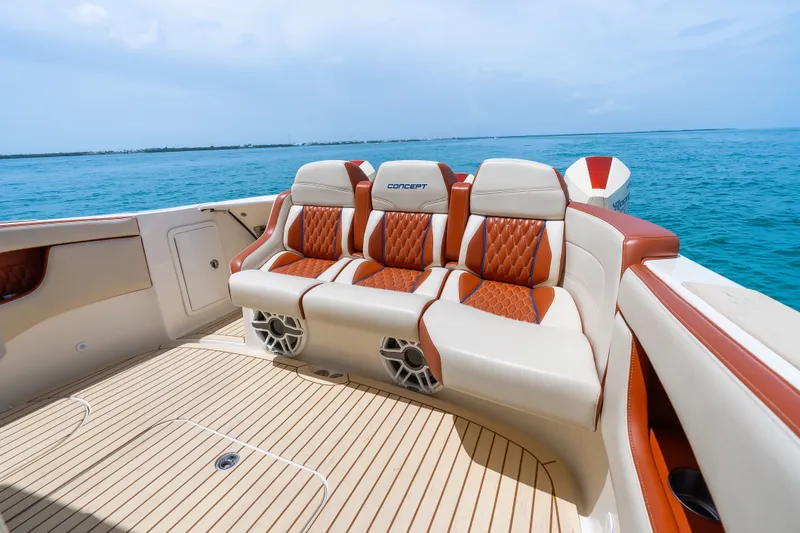 Slide: The Image of Luxurious seating on 2024 Concept 44' Open Deck boat, featuring elegant design and ocean backdrop. - 27