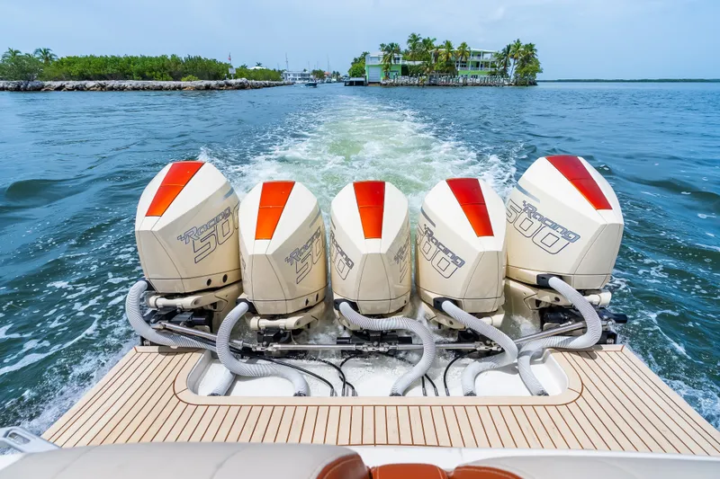 Slide: The Image of Powerful 2024 Concept 44' Open Deck boat with five Racing 500 engines cruising on water. - 30