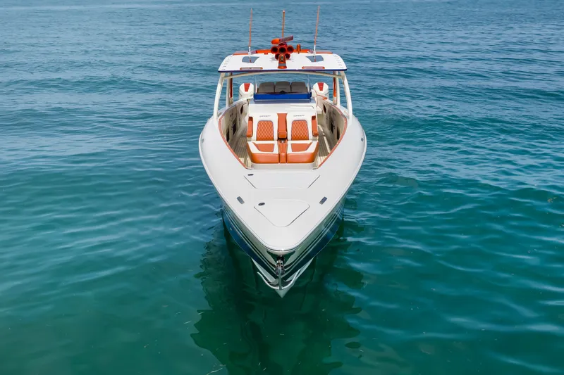 Slide: The Image of 2024 Concept 44' Open Deck boat on clear blue water, front view. - 13