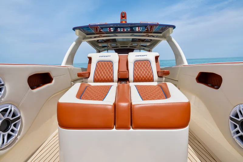 Slide: The Image of Luxurious seating on 2024 Concept 44' Open Deck boat with ocean backdrop. - 38