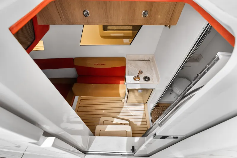 Slide: The Image of Interior of 2024 Concept 44' Open Deck boat with modern seating and compact amenities. - 45