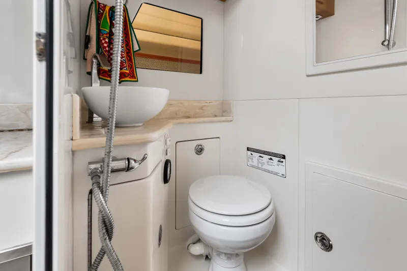 Slide: The Image of Modern bathroom in 2024 Concept 44' Open Deck boat, featuring sleek fixtures and compact design. - 46