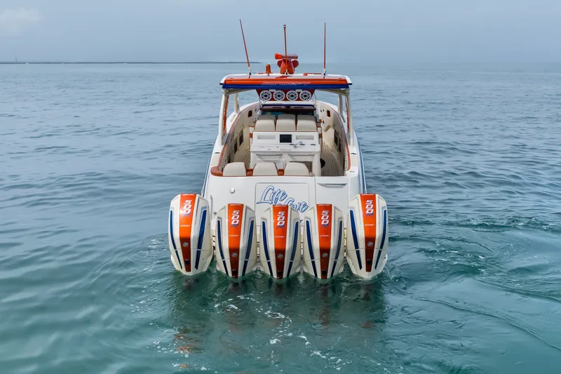 Slide: The Image of 2024 Concept 44' Open Deck boat with four powerful outboard engines on open water. - 16