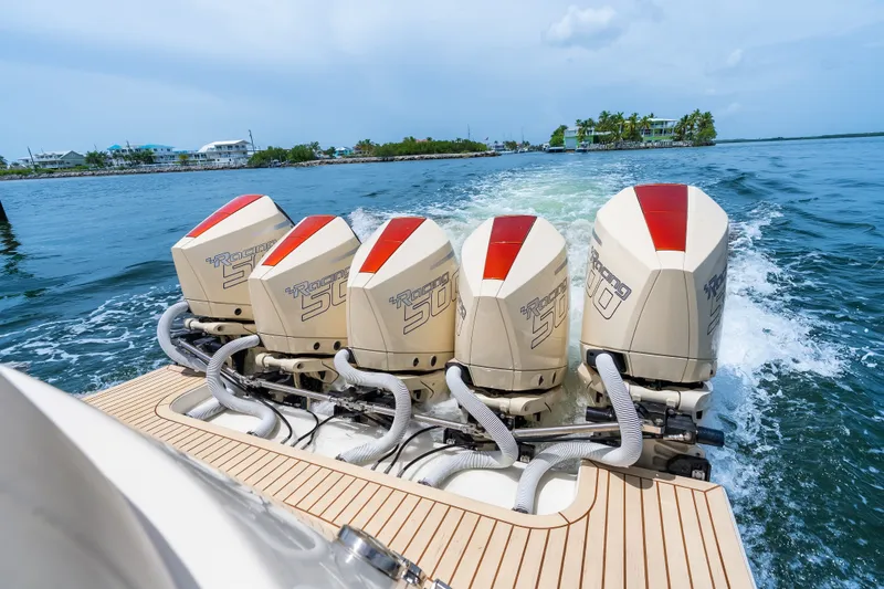 Slide: The Image of Powerful 2024 Concept 44' Open Deck boat with five racing outboard engines on water. - 31