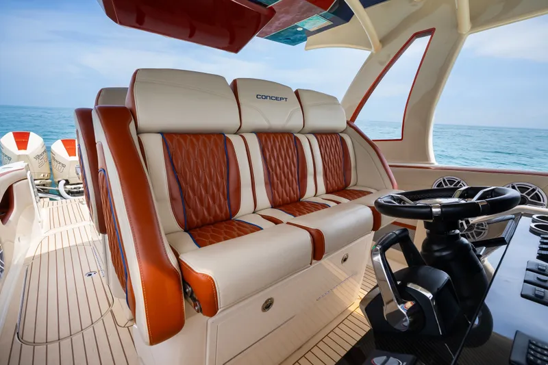 Slide: The Image of Luxurious interior of 2024 Concept 44' Open Deck boat with plush seating and modern steering. - 23