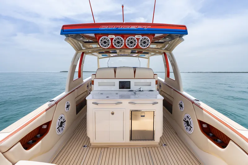 Slide: The Image of 2024 Concept 44' Open Deck boat with luxurious interior and modern amenities on open water. - 24
