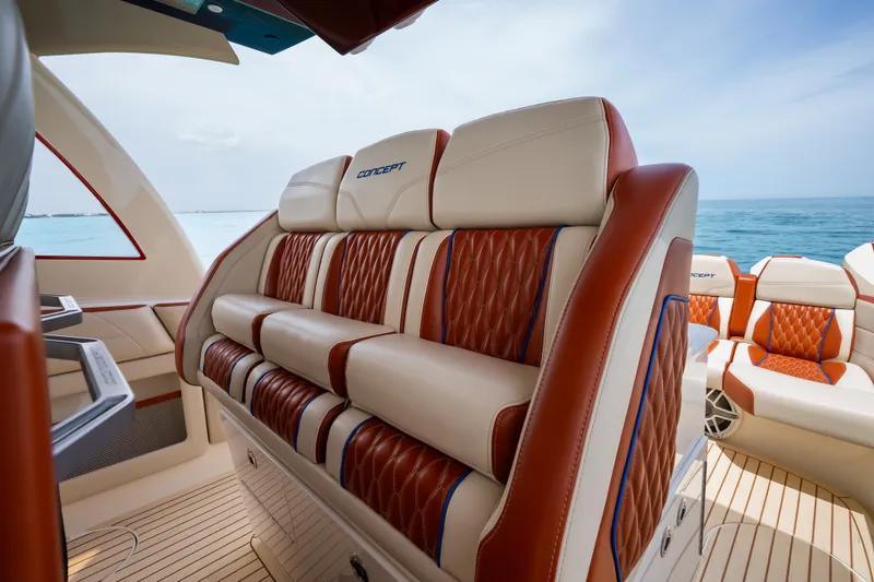 Slide: The Image of Luxurious seating on 2024 Concept 44' Open Deck boat with ocean backdrop. - 21
