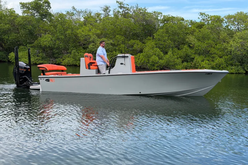 The Image of 2026 Latitude Tournament Boats 25 on water, featuring sleek design and vibrant orange accents. - 0