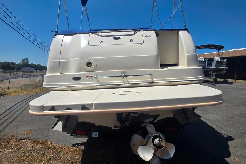 Slide: The Image of Rear view of a 2004 Sea Ray 240 Sundancer boat with propeller and swim platform. - 7