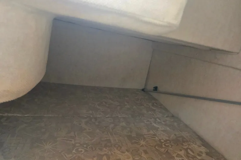 Slide: The Image of Interior cabin view of a 2004 Sea Ray 240 Sundancer boat. - 22