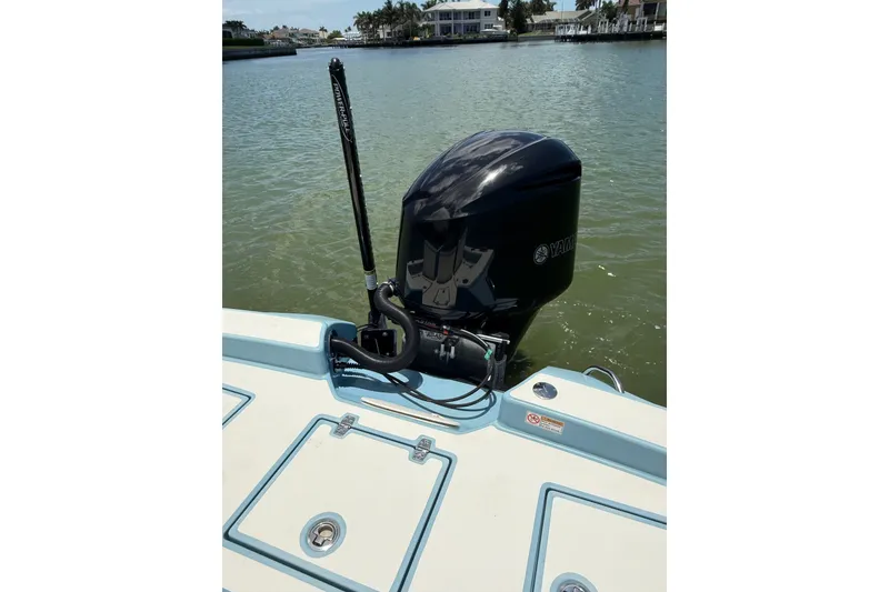 Slide: The Image of 2021 Pathfinder 2600 TRS boat with Yamaha outboard motor on calm water. - 17