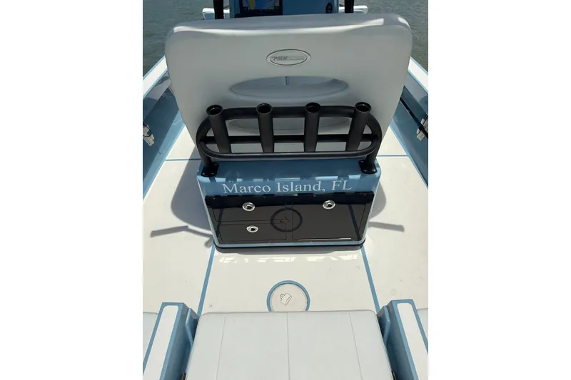 Slide: The Image of 2021 Pathfinder 2600 TRS boat interior, Marco Island, FL, featuring rod holders and storage. - 18