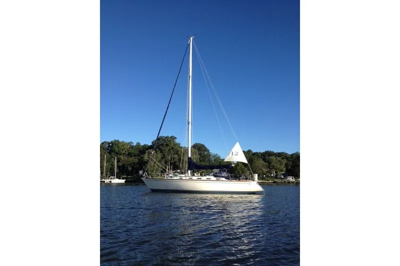 The Image of Sailboat on calm water, Tartan 40 model from 1987, under clear blue sky. - 0