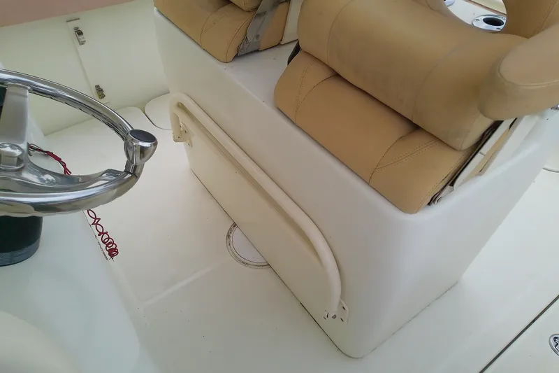 Slide: The Image of Boat interior with beige seating and steering wheel, Release 301 RXS, 2016 model. - 27