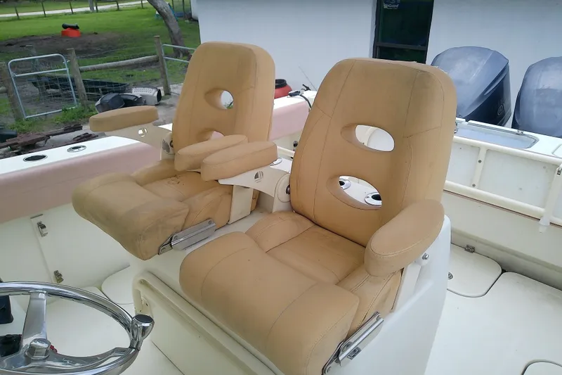 Slide: The Image of Two beige captain's chairs on a 2016 Release 301 RXS boat deck. - 29