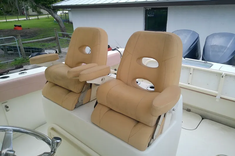 Slide: The Image of Two beige captain's chairs on a 2016 Release 301 RXS boat deck. - 26