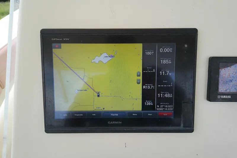 Slide: The Image of Garmin GPS display on 2016 Release 301 RXS boat, showing navigation map and data. - 15