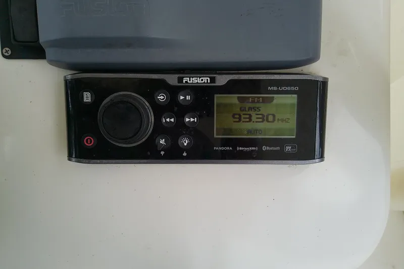 Slide: The Image of Radio display showing FM station 93.30 MHz on a Fusion MS-UD650 unit. - 16