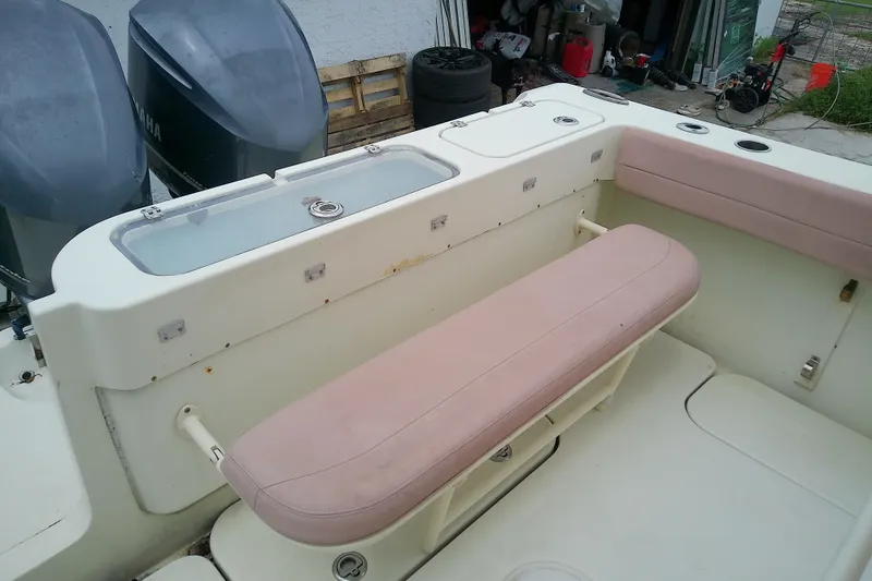 Slide: The Image of 2016 Release 301 RXS boat interior with seating and storage compartments. - 23