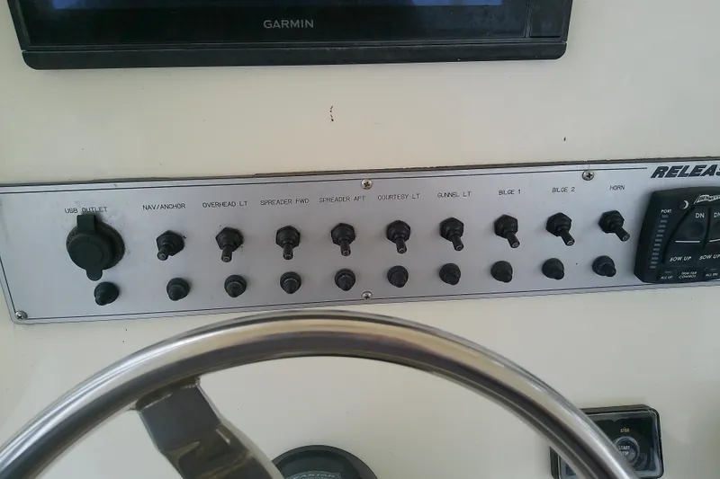 Slide: The Image of Control panel of a 2016 Release 301 RXS boat with switches and USB outlet. - 20