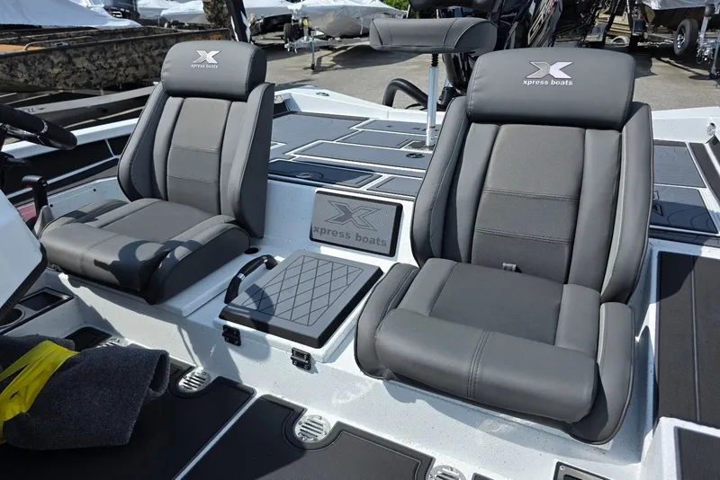 Slide: The Image of Two gray seats on a 2027 Xpress X19 Pro boat deck. - 14