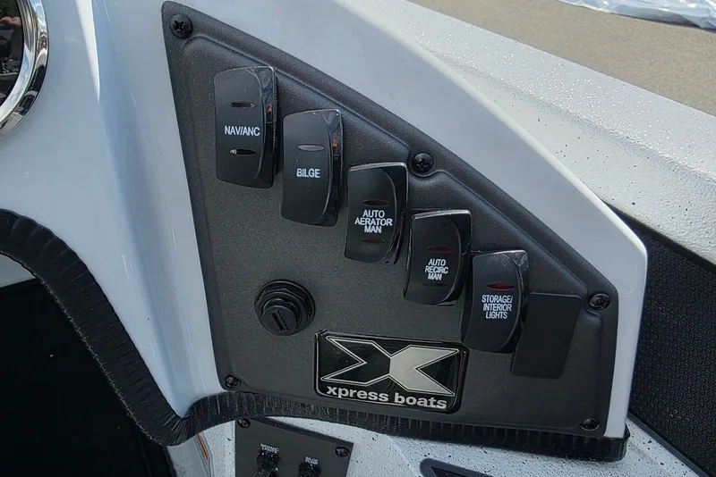 Slide: The Image of Control panel of 2027 Xpress X19 Pro boat with labeled switches. - 17