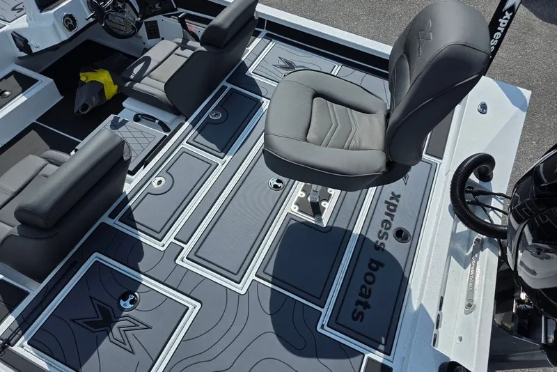 Slide: The Image of Interior of 2027 Xpress X19 Pro boat with sleek seating and modern design. - 18
