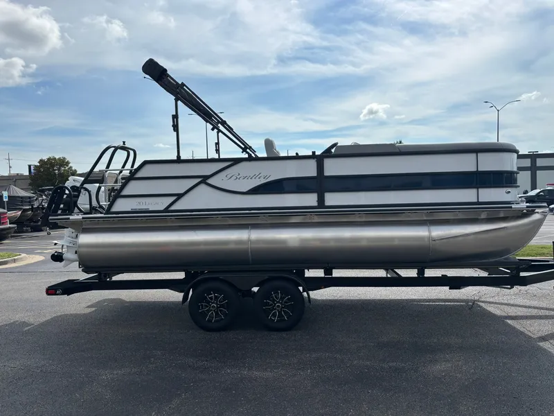 Slide: The Image of A 2027 Bentley Pontoons 200 Legacy Swingback on a trailer, ready for transport. - 11